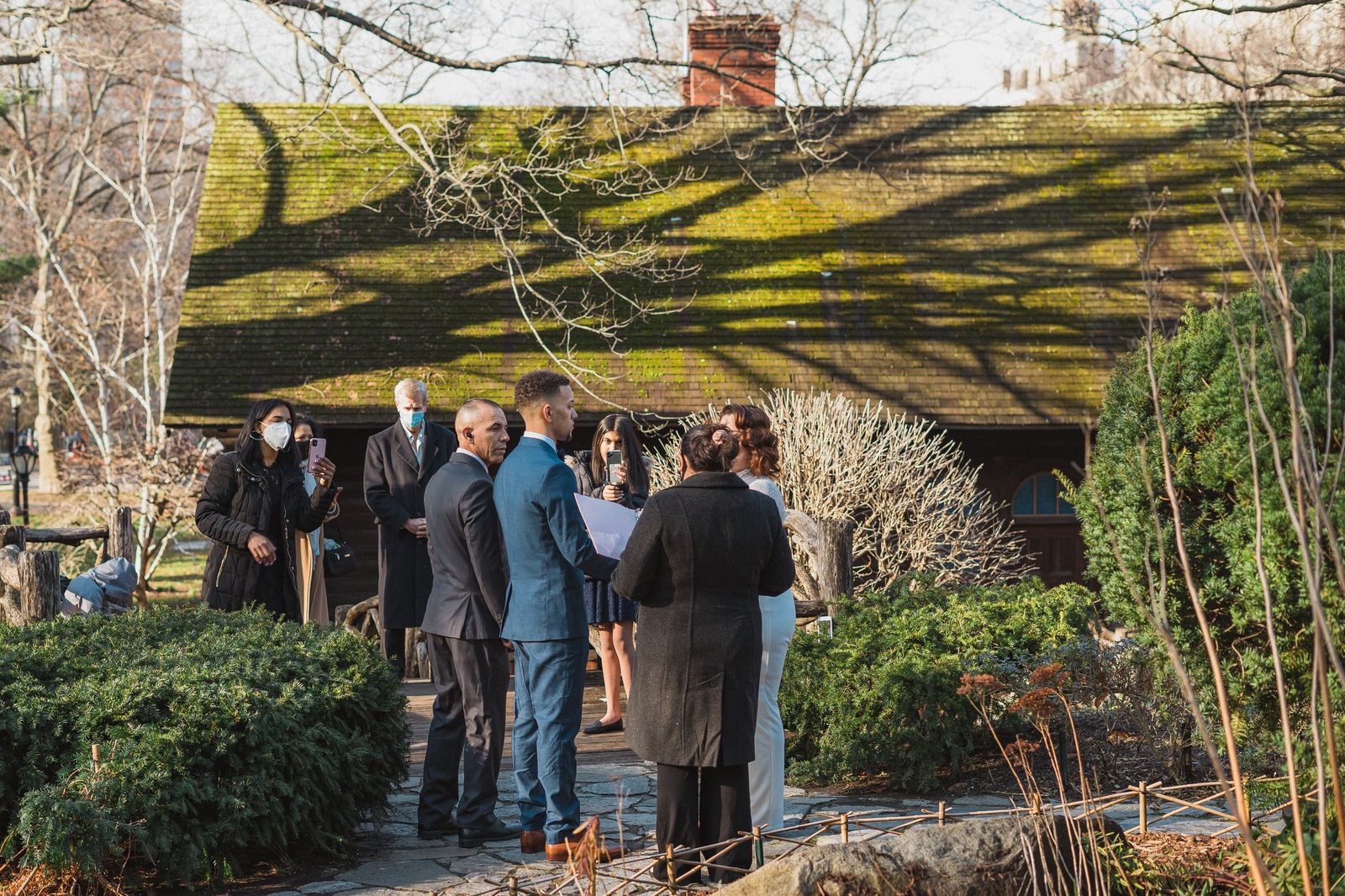 Officiant leading a wedding ceremony at Shakespeare Garden in Central Park