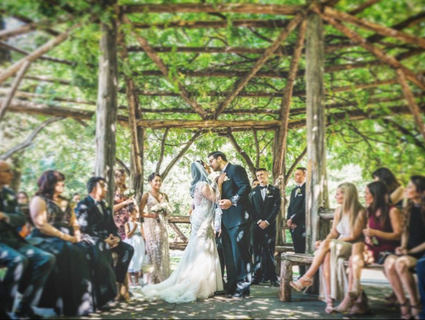 The ceremony kiss under the Cop Cot shelter - Central Park Wedding - New York City