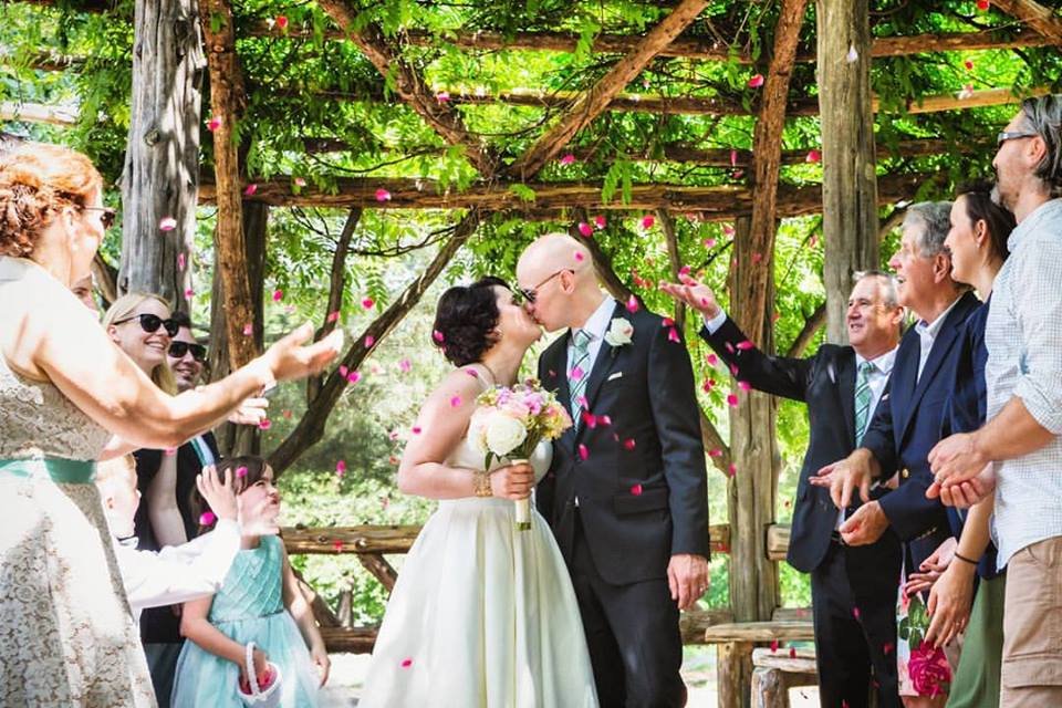 Petal toss kiss at Cop Cot - Central Park Wedding - New York City