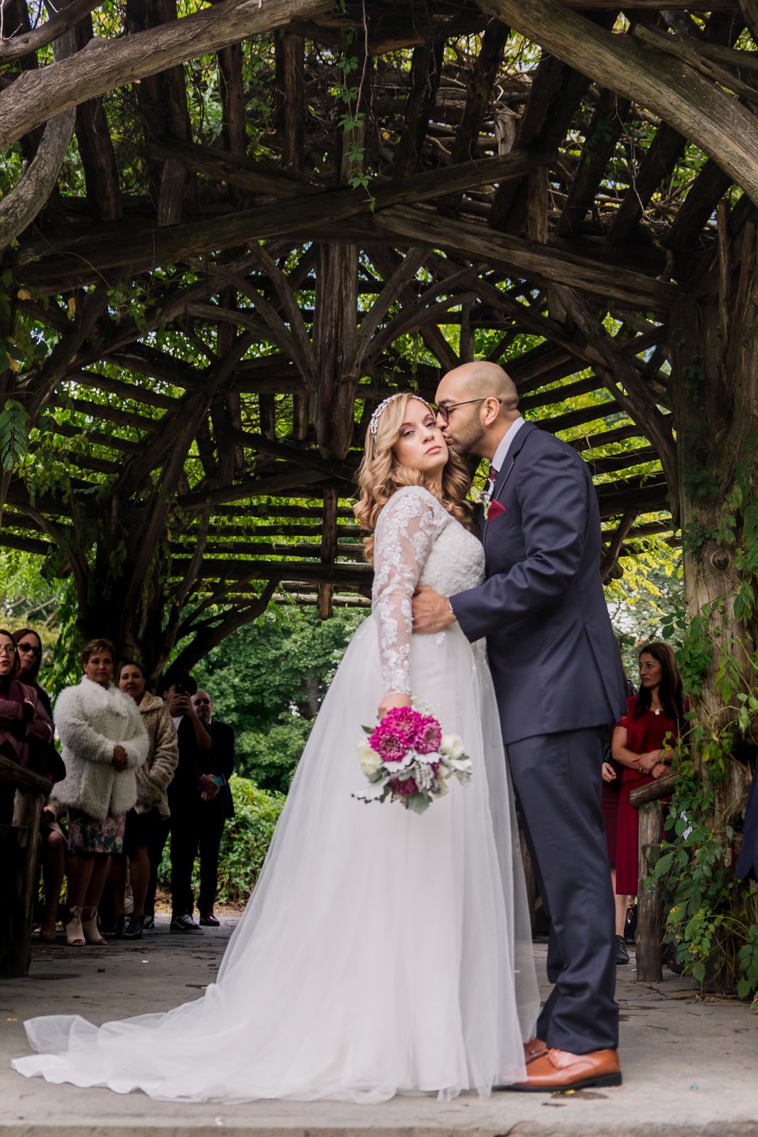 Cheek kiss at the Dene Summerhouse - Central Park Wedding - New York City