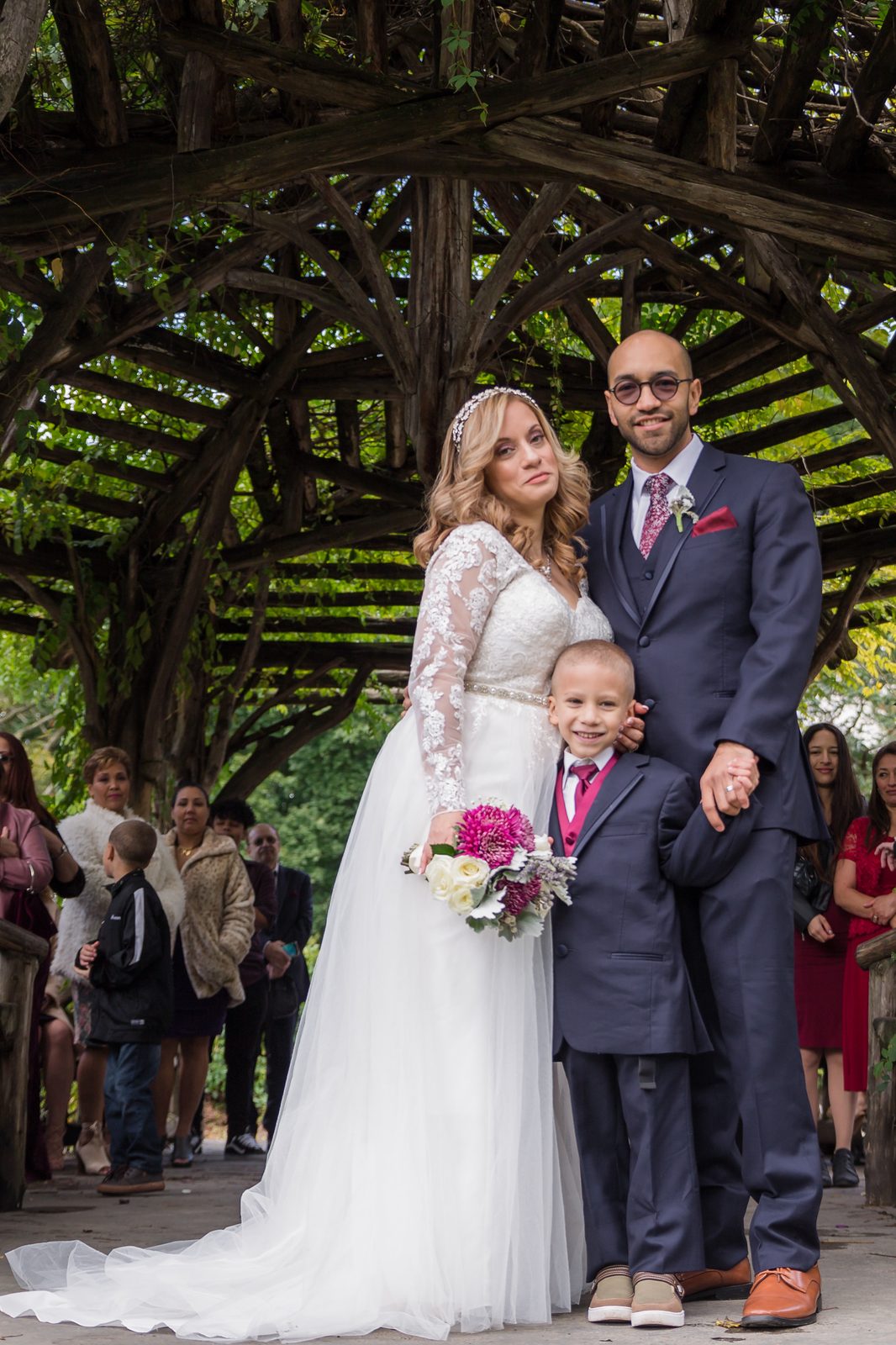 Family gathered under the Dene Summerhouse pergola - Central Park Wedding - New York City