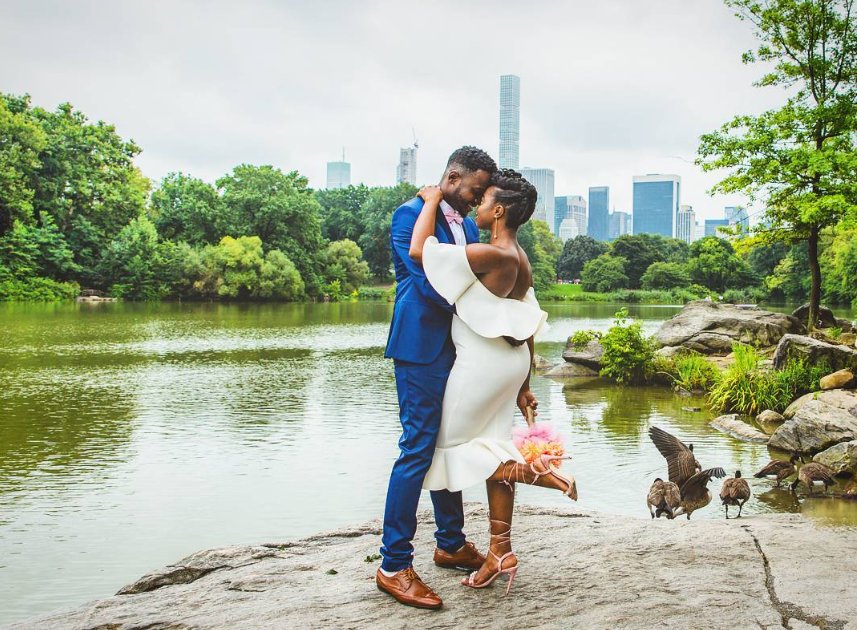 Embrace on the lake rocks at Ladies Pavilion - Central Park Wedding - New York City